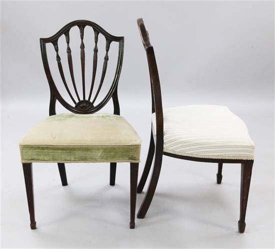A pair of George III Hepplewhite period shield back chairs,